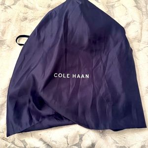 Cole Haan casual purse. New without tags. Gorgeous deep navy with gold accents.